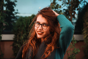 woman with red hair holding it